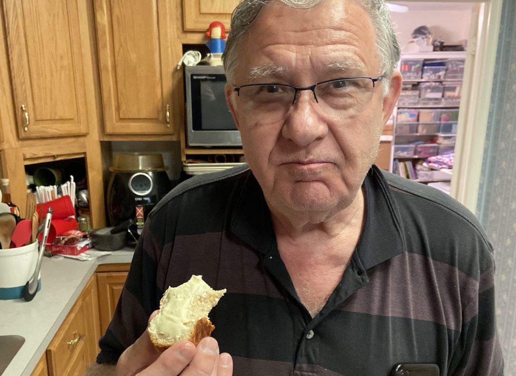 Dad testing out Jonathan's first batch of homemade bread